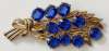 Gilt Potmetal Floral Spray Brooch w/ Blue Glass Stones